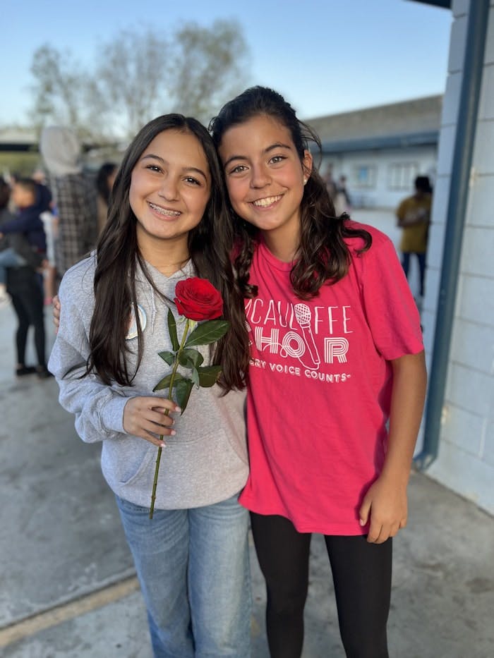 Img: flower, rose, face, person, smile, pants, flower arrangement, female, girl, teen