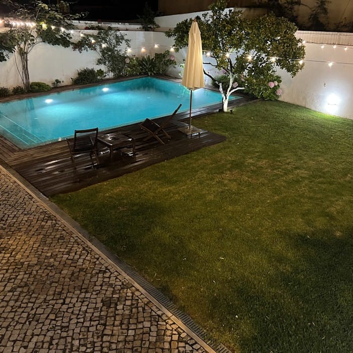 Img: pool, water, swimming pool, outdoors, backyard, chair, floor, grass, aerial view, candle