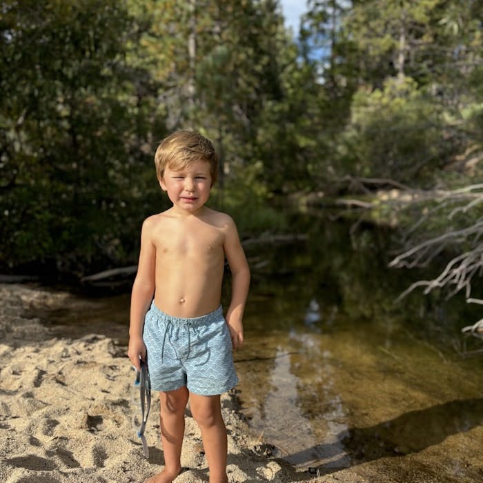 Img: clothing, shorts, boy, child, male, person, photography, portrait, plant, tree