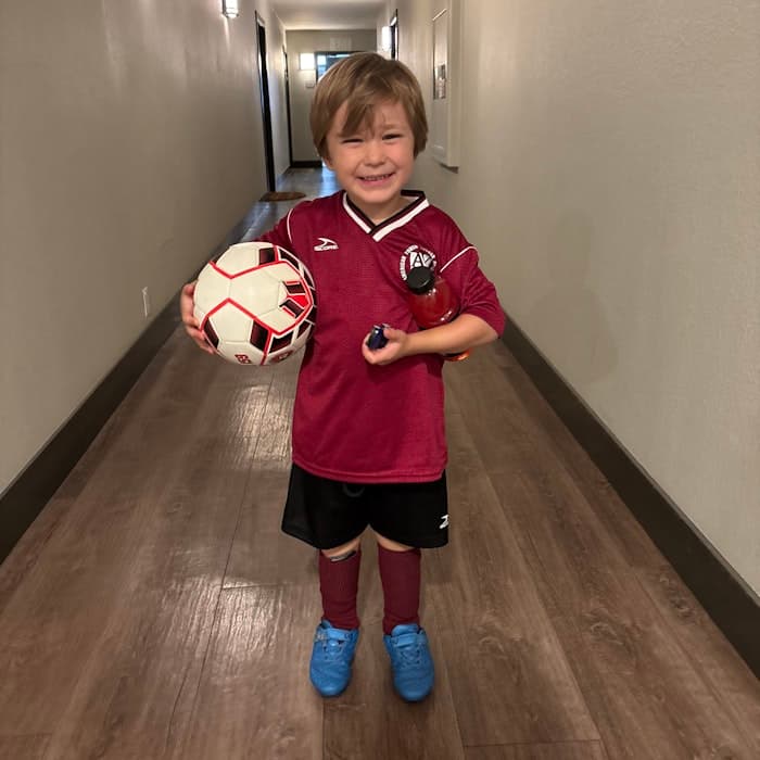 Img: soccer ball, floor, flooring, sphere, hardwood, wood, boy, child, male, person