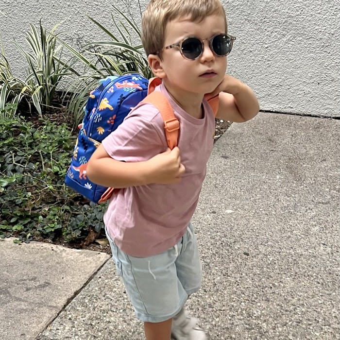 Img: bag, boy, child, male, person, accessories, sunglasses, pants, backpack, shorts